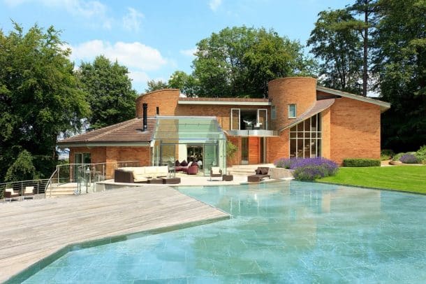 Carol Vorderman’s home in Somerset which is up for sale. See SWNS story SWCAROL; TV brainbox Carol Vorderman has put her posh party home on the market for £2.7 million. The former Countdown star, 55, bought the home in 2007 and quickly applied for planning permission to rename it Sloblock - an anagram of B*llocks. She then spent two years carrying out a lavish refurbishment of the home, fitting so much insulation she hardly has to heat it. Sloblock was built in the 1970s and designed on a series of concentric circles, combining modern architecture and minimalist design., Image: 292475509, License: Rights-managed, Restrictions: follow us on twitter - @swns browse our website - swns.com email pix@swns.com, Model Release: no, Credit line: Profimedia, SWNS